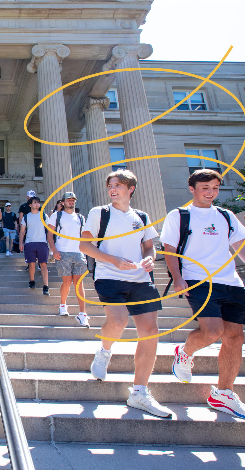 Students walk down the steps outside Curtiss Hall on the first day of the fall semester