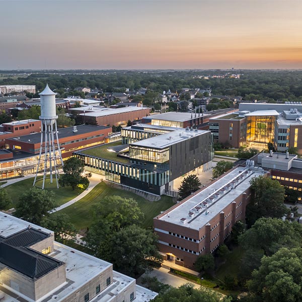 Sunset aerial view of west campus, including Marston Tower.