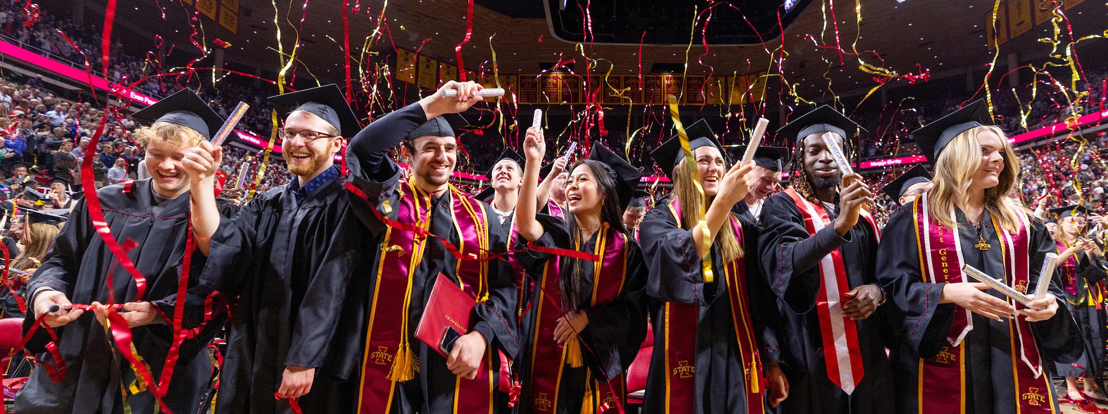 Graduates celebrate with streamers at the conclusion of the commencement ceremony.