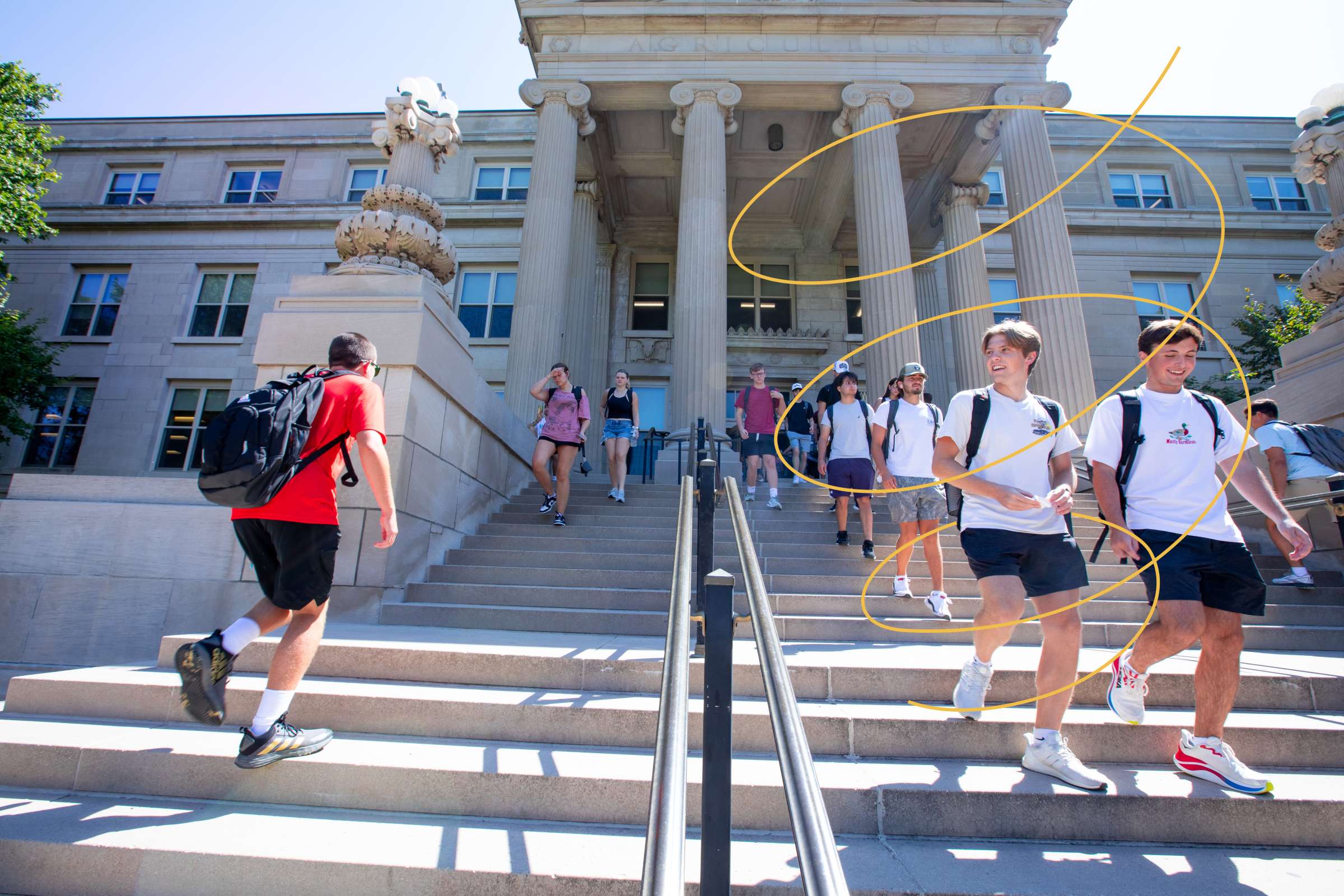 Students walk down the steps outside Curtiss Hall on the first day of the fall semester