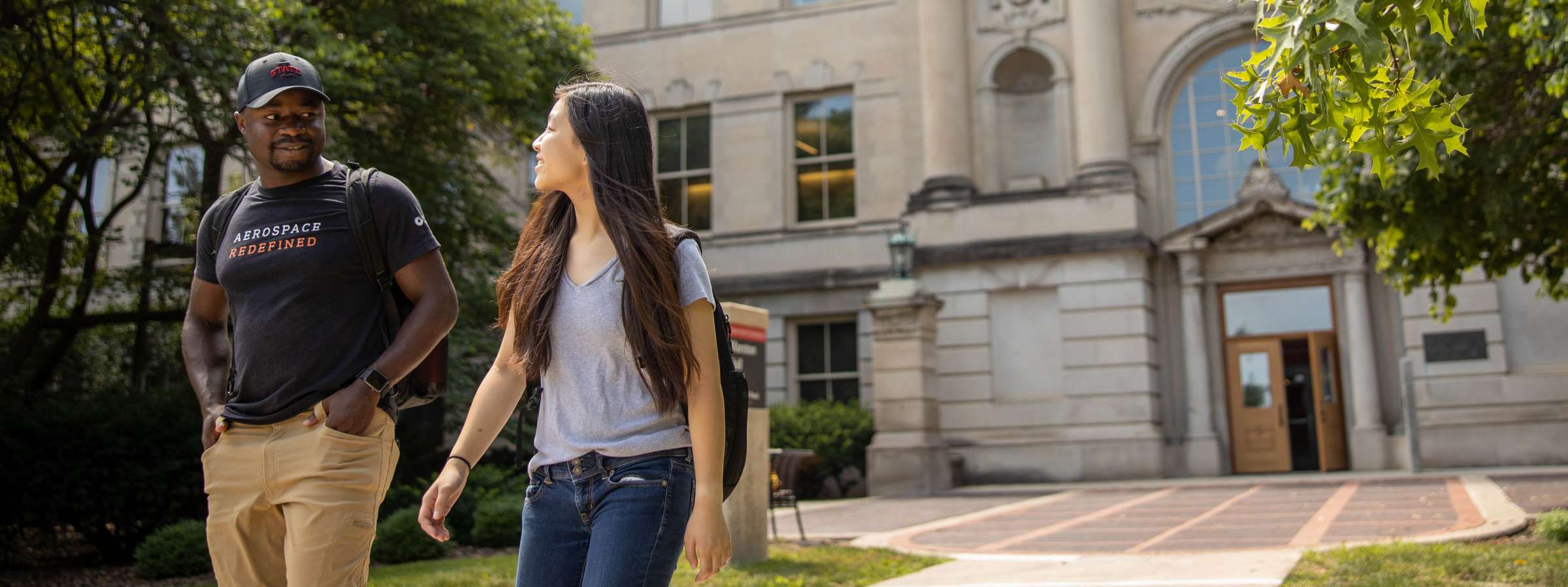 Two students walking outside of Marston Hall